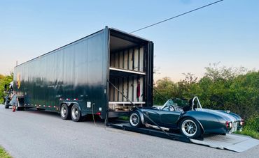 1965 Shelby Cobra being transported in an enclosed semi. 