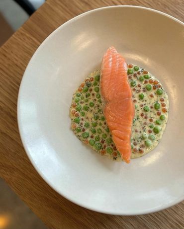 Poached Salmon with peas, roe and Champagne sauce.