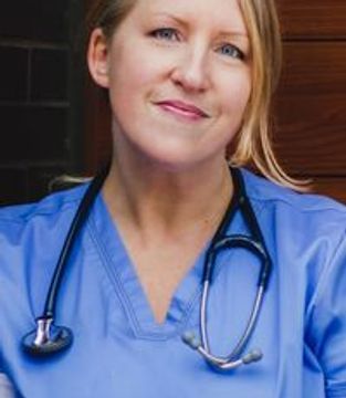 Professional headshot of Ingrid Anderson in scrubs