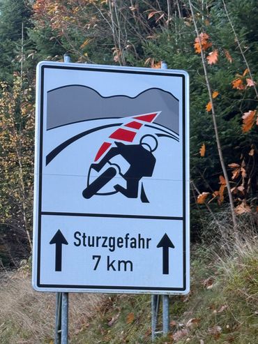 motorbike sign winding roads