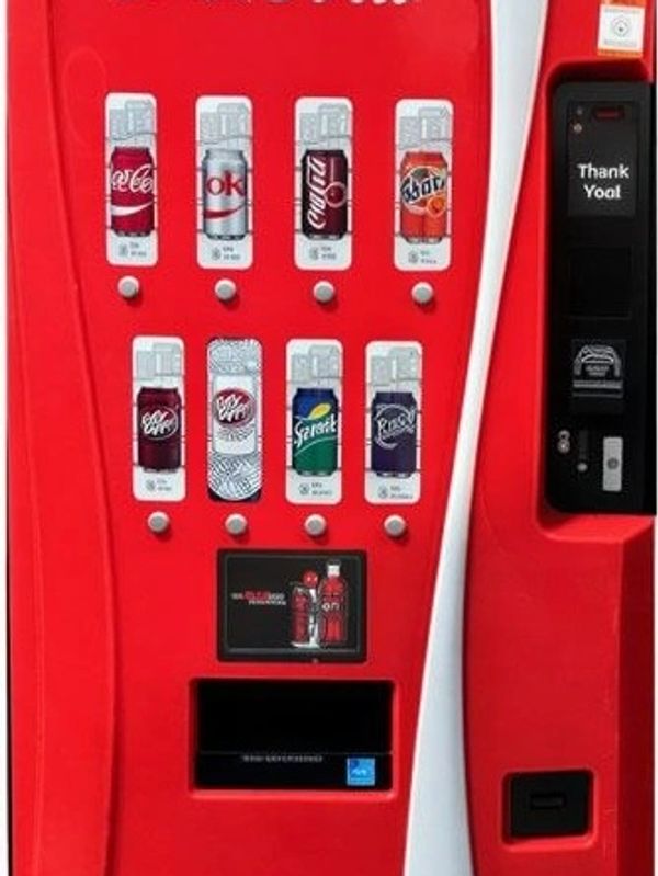 Red soda vending machine with multiple drink options.