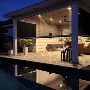 Solara Shades outdoor screens installed on a residential patio, offering privacy and shade protectio.