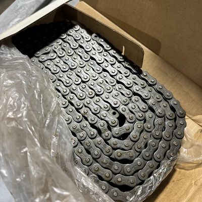 Box containing a coiled metal chain.