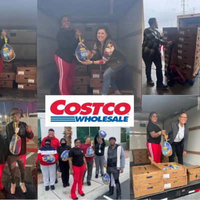 Group of people handling turkeys and boxes at Costco Wholesale.