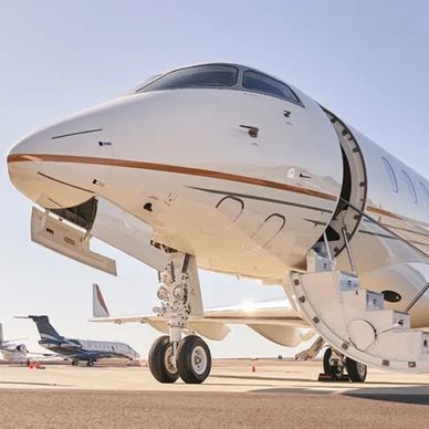 colleagues walking next to private jet 