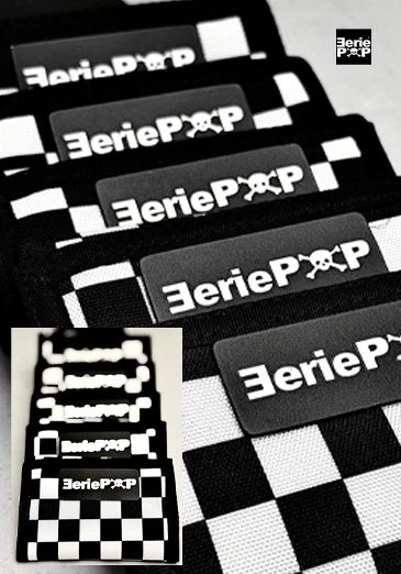 Black and white checkered EeriePop wallets lined up.
