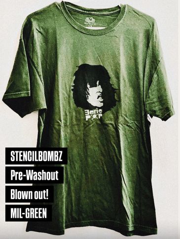 Green T-shirt with black stencil art and text.