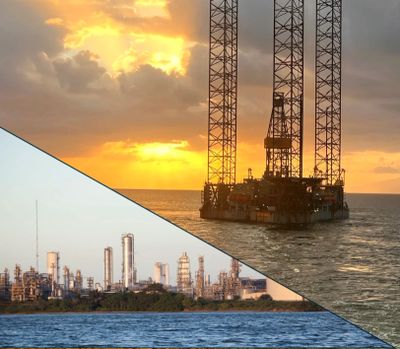 An offshore oil rig at sunset and a coastal refinery side by side.