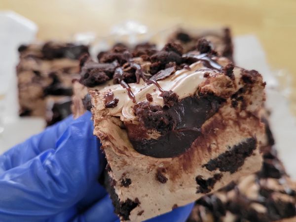Chocolate Marshmallow with rich dark chocolate brownie chunks and ribbons of decadent hot fudge 