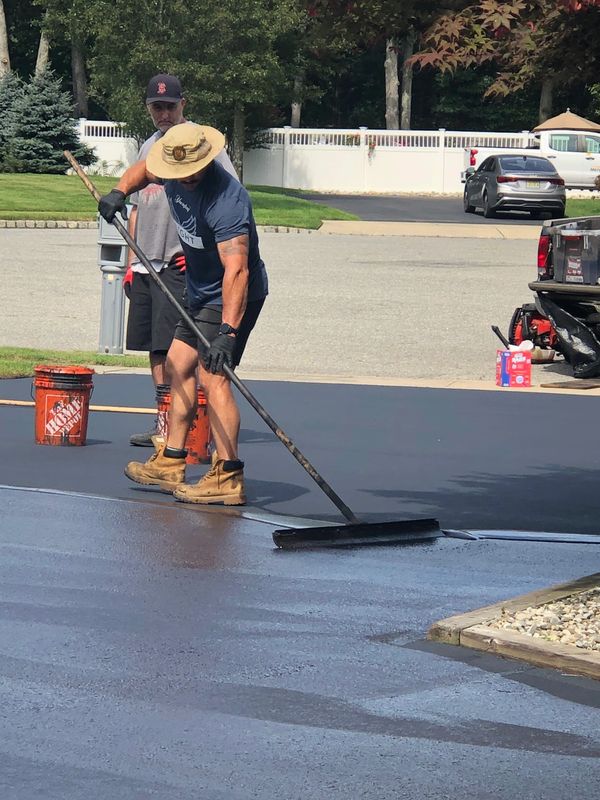 Expert Sealcoating Services for Your Driveway and Asphalt Surfaces