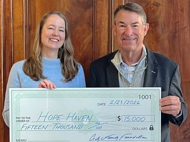 Dale Critz Jr. presents check to Hope Haven director.