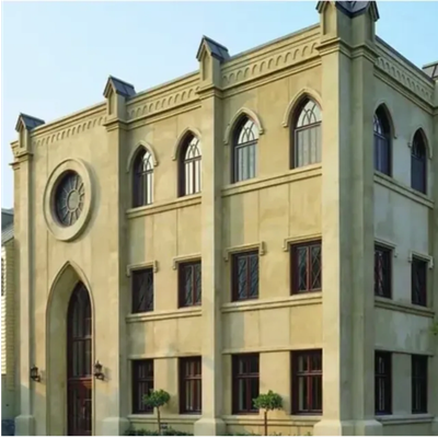 A beige Gothic-style building with arched windows and a large circular window.