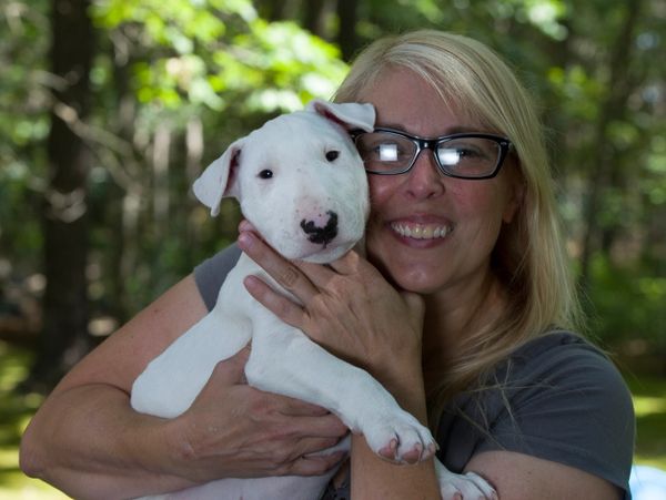 Heidi Clayton with a puppy during puppy training