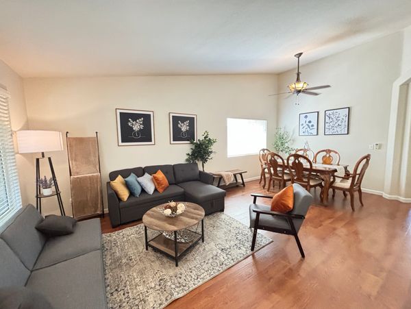 Cozy living and dining room with modern furniture and warm decor.