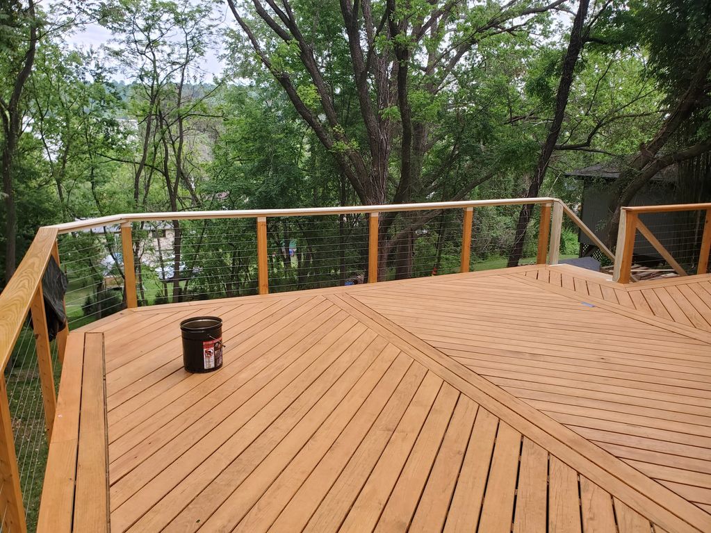 Amazing deck addition using KDAT decking and stainless steel cable railing in Asheville, NC.