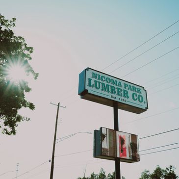 Building Materials and lumber signage at Nicoma Park Lumber displaying lumber yard near me