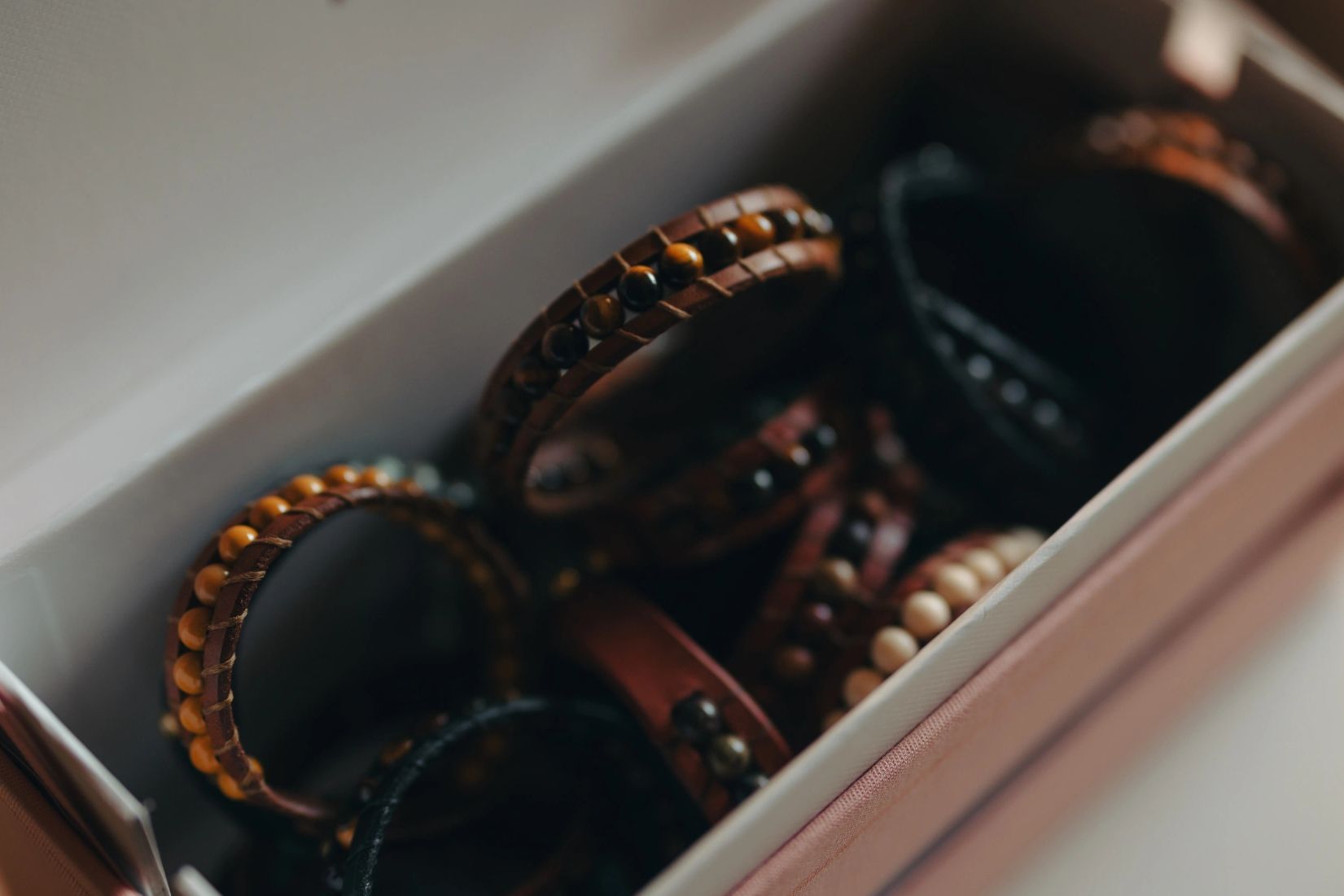 Leather bracelets with beads in a box.