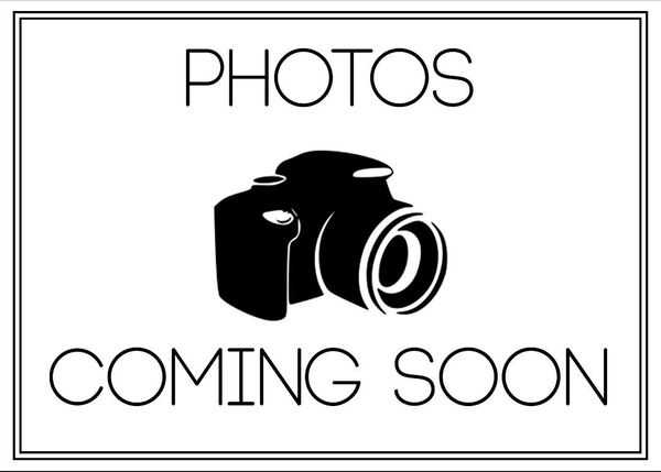 Black camera icon with 'Photos Coming Soon' text on white background.