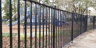 Commercial aluminum fence installation on a playground in Tioga, FL