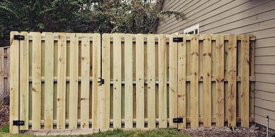 Shadow box fence in Gainesville, FL with double drive gate.