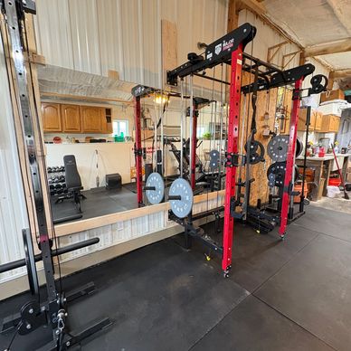 Gym setup with weight machine and various equipment.