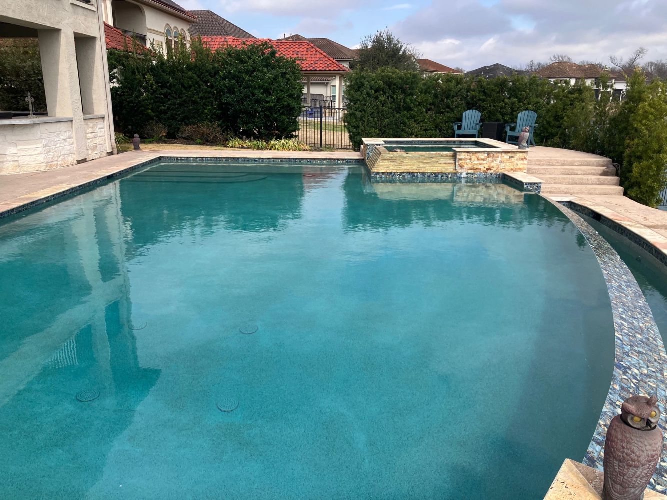 Elegant pool with raised spa and infinity edge.