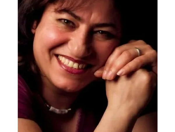 This is a picture of Bita who is the founder of Bright Blossoms Academic Child Care. She is smiling