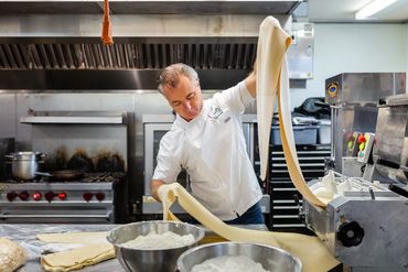 Man working on noodles making machine