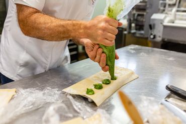 A cook design pasta on green shafe