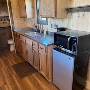 a small kitchen counter and appliances 