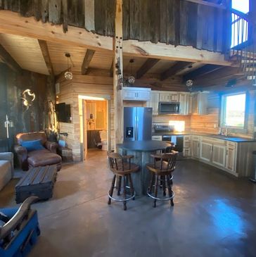 a living space and attached kitchen area 
