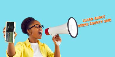 woman with a loudhorn speaking