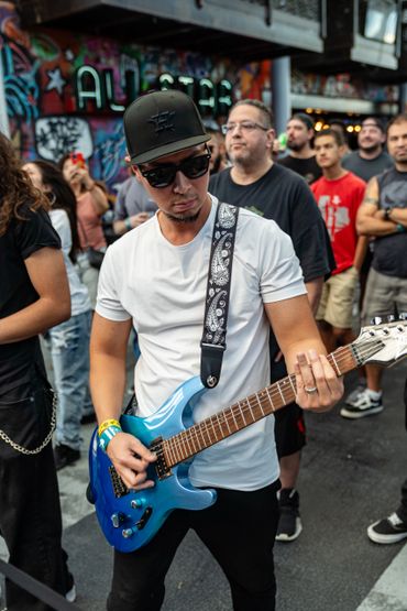 Guitarist in a crowd.