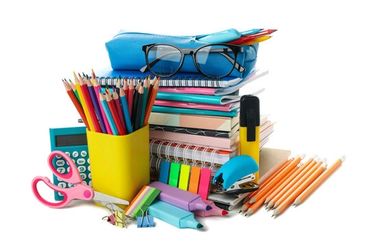 A collection of colorful stationery items including pencils, notebooks, and glasses.