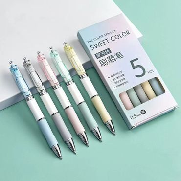 Set of five pastel-colored 0.5mm ballpoint pens with matching packaging.