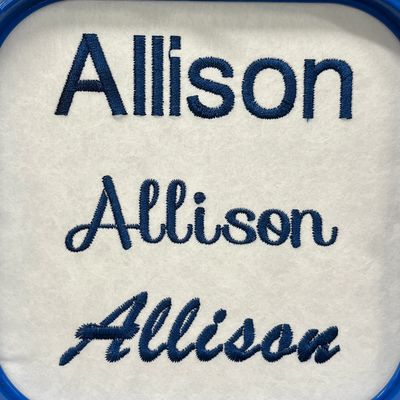 Three different embroidered fonts of the name 'Allison' in blue thread.