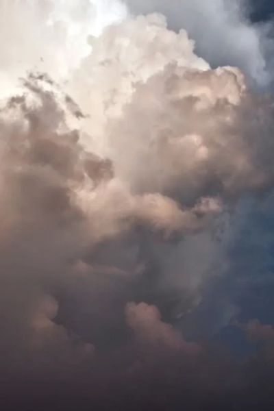 Beautiful blowing big fluffy white and gray clouds 