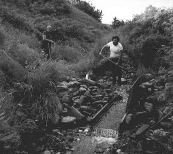 Raymond L. Garrett L, and Dale James (r), sluicing for gold on Lucky Creek, Dutch Hills Alaska. 1989