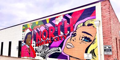 pop art mural by spaceship zulu entitled "this is us" in North Kansas City 