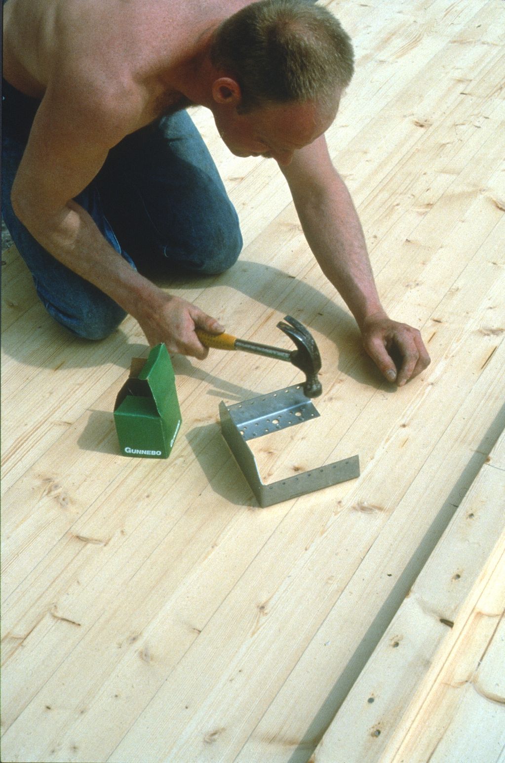 Nailing metal plate connector to glulam beam