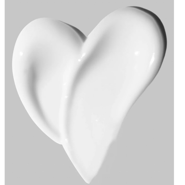 Heart- shaped lotion swipe symbolizing love and hydration in natural skincare.