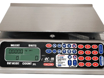 Digital weighing scale with numeric keypad and display screen.