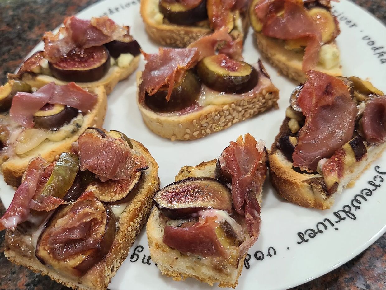 Building the Fig, Prosciutto , Roasted Garlic Crostini