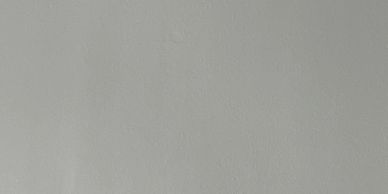 A plain light gray wall.