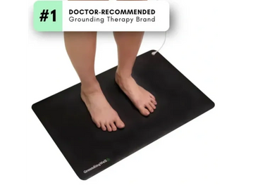 a person standing on a GroundingWell Mat