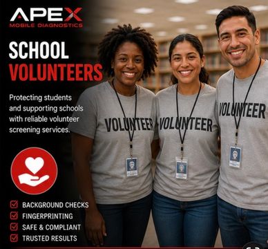 Three smiling school volunteers wearing volunteer badges and shirts.