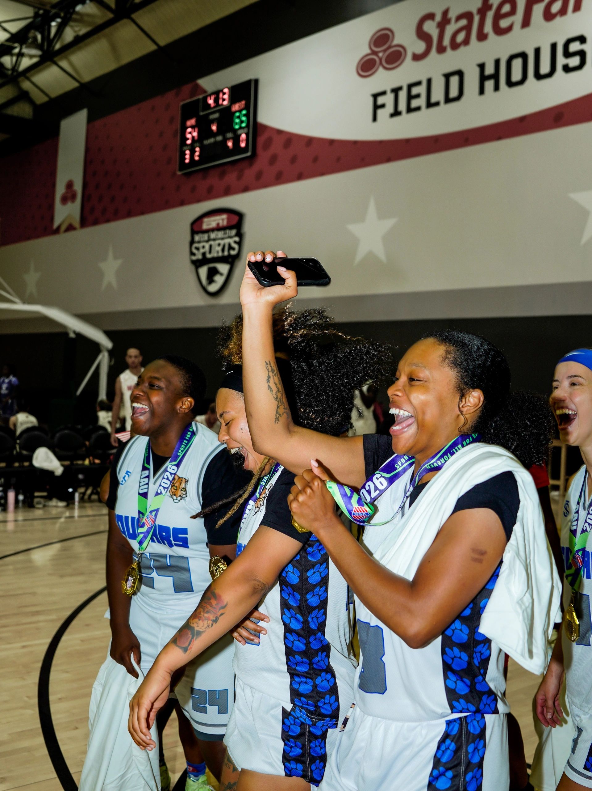 Lady Cougars celebrate winning the 2026 AAU Adult National Championship in Orlando, FL.