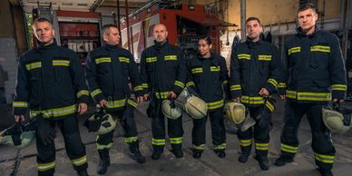 six people in work attire with helmets 