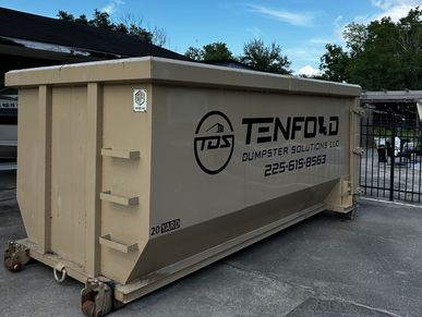 A beige 20-yard dumpster with branding on the side.