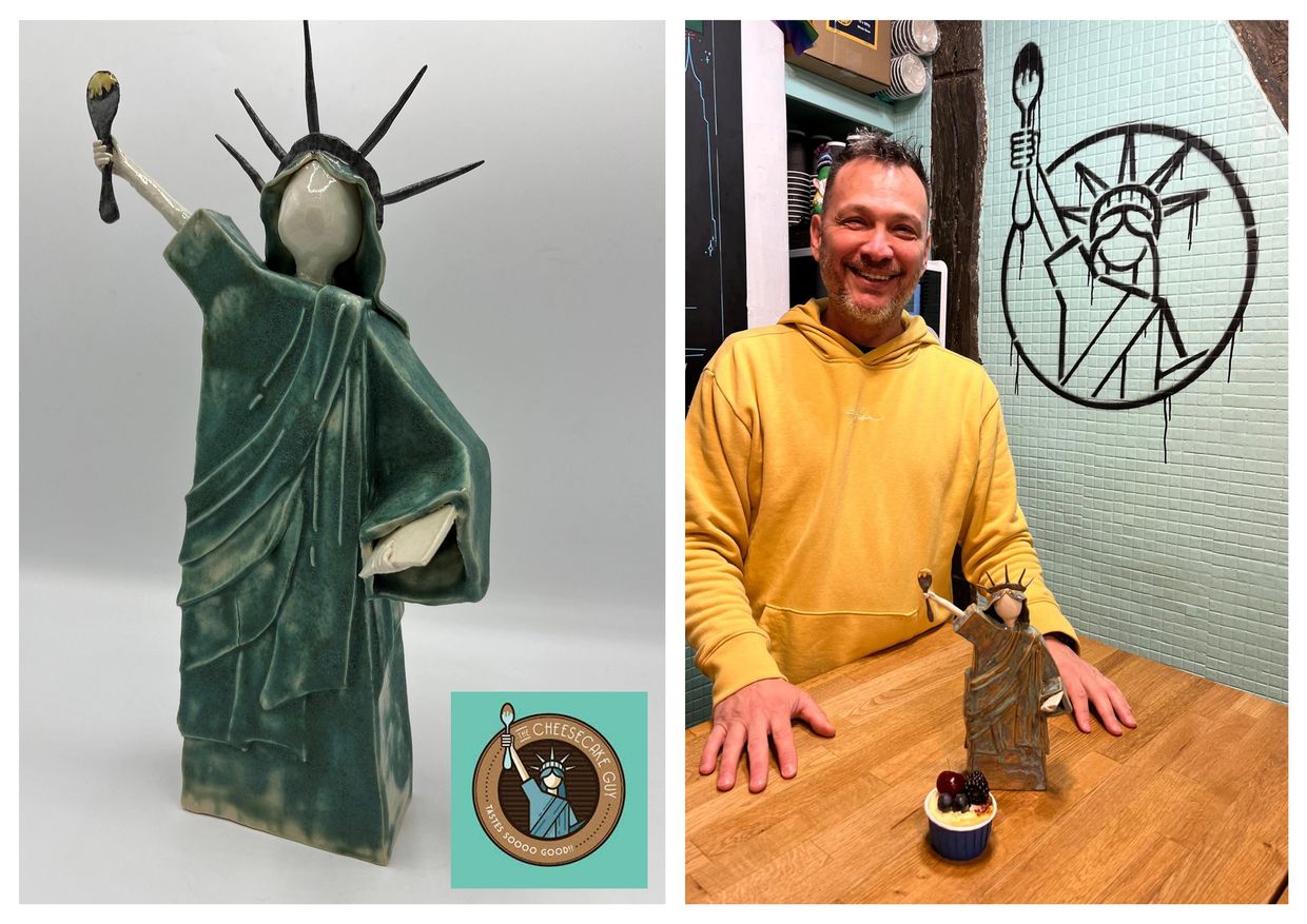 ceramic sculpture of the statue of liberty holding a spoons up with sauce dripping off it. Schiewe 